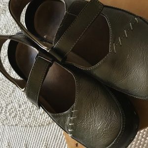 Wonky leather clogs with strap